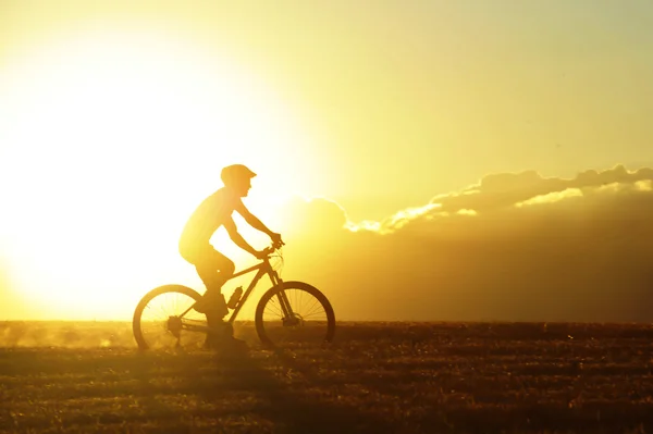 Profile silhouette sport man riding cross country mountain bike — Stock Photo, Image