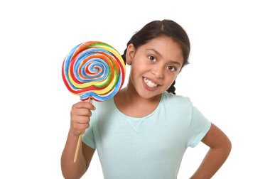 happy female child holding big lollipop candy in cheerful face expression in kid love for sweet concept