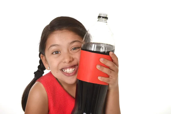 Happy female child holding big soda bottle against her face in crazy and over excited expression — Stok fotoğraf