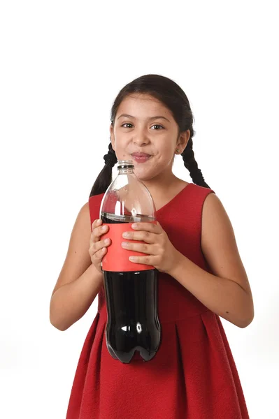Happy female child holding big soda bottle against her face in crazy and over excited expression — Stock fotografie