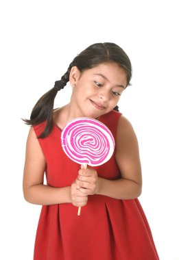 sweet beautiful latin female child holding big pink spiral lollipop candy