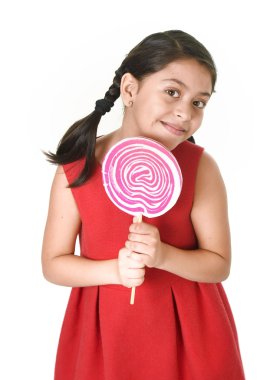 sweet beautiful latin female child holding big pink spiral lollipop candy
