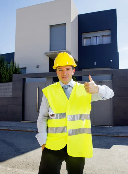 Foreman worker standing in front of new building project  outdoors wearing construction helmet — Stock Fotó