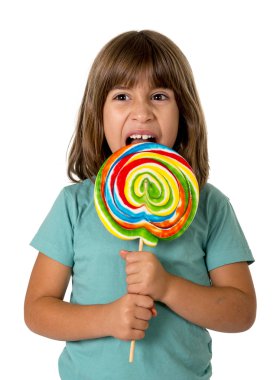 child eating big lollipop candy isolated on white background in children love sweet sugar concept and dental health care concept