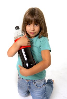 little female child holding big cola soda bottle looking vulnerable in children sugar addiction