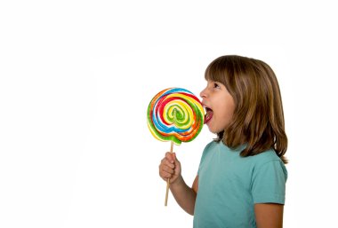 child eating big lollipop candy isolated on white background in children love sweet sugar concept and dental health care concept