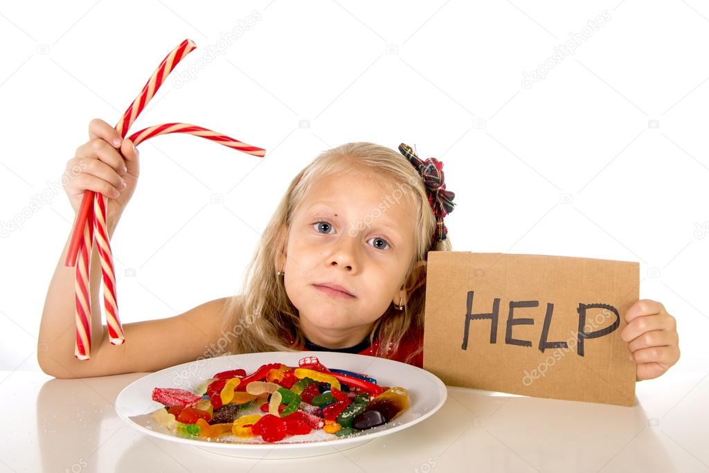 little female child nutrition abuse of sweet and sugar in candy unhealthy food asking for help