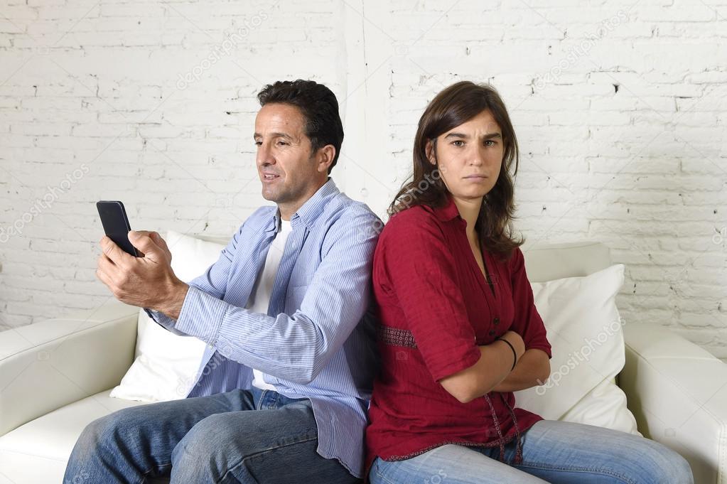 social network addict man using mobile phone ignoring wife or girlfriend upset and angry