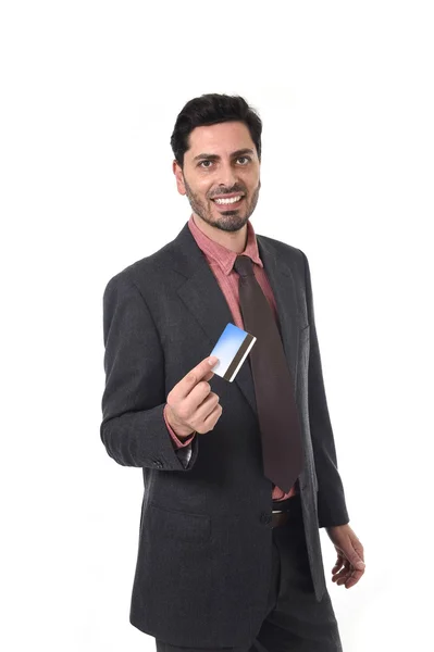 Happy attractive businessman holding credit card in commerce and banking concept — Φωτογραφία Αρχείου