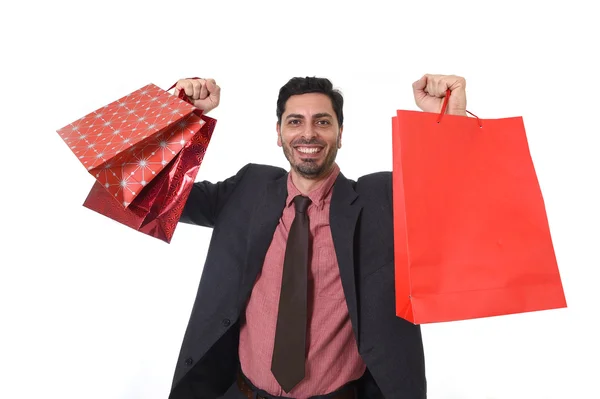 Joven empresario atractivo sosteniendo bolsas de compras en venta y concepto de oportunidad de mercado — Foto de Stock