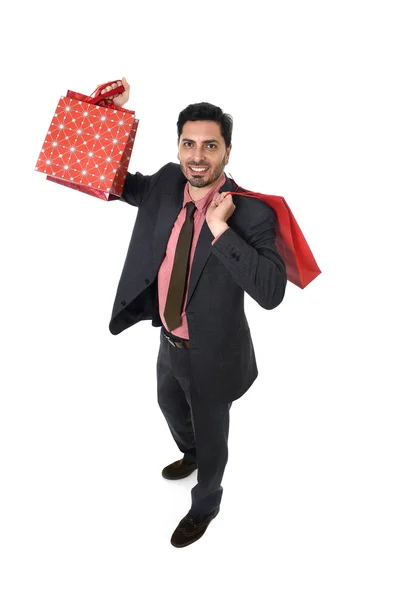 Young attractive businessman holding shopping bags in sale and market opportunity concept — Zdjęcie stockowe