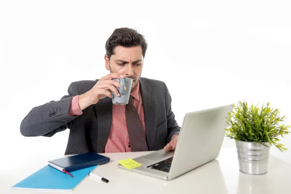 Young attractive Latin businessman in suit and tie working at of — Stock Photo, Image