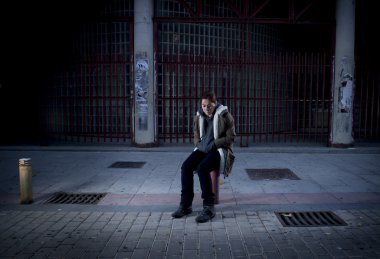 woman alone on street suffering depression looking sad desperate