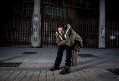 woman alone on street suffering depression looking sad desperate