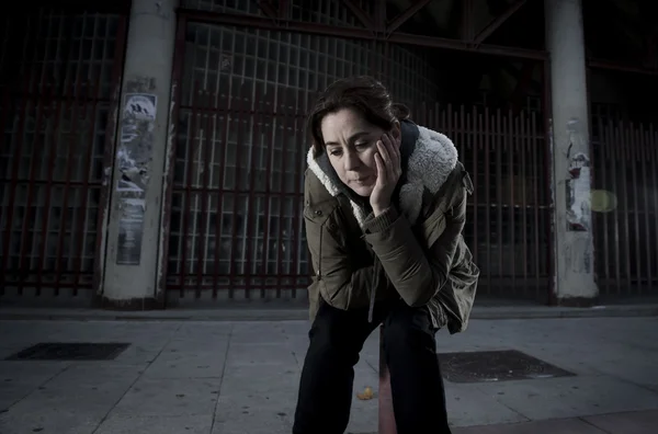 Woman alone on street suffering depression looking sad desperate — Stockfoto