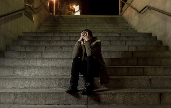 Sad woman alone on street subway staircase suffering depression looking looking sick and helpless — Stock Photo, Image