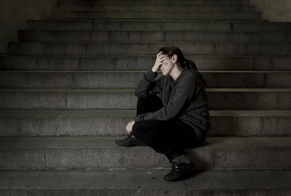 Sad woman alone on street subway staircase suffering depression looking looking sick and helpless — Stock Photo, Image