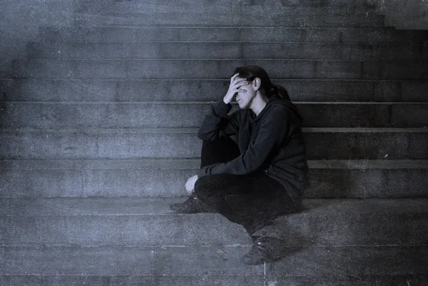 Sad woman alone on street subway staircase suffering depression — Stock Photo, Image