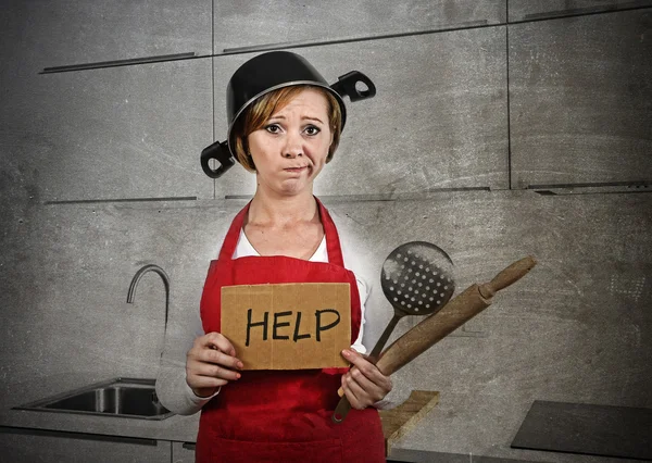 Home cook woman confused and frustrated in apron and cooking pot as helmet asking for help — Zdjęcie stockowe