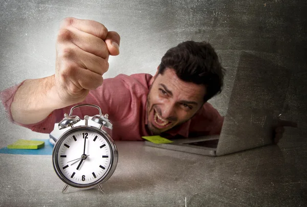 Crazy businessman switching off alarm clock sitting at office working with computer deadline project concept — Stockfoto