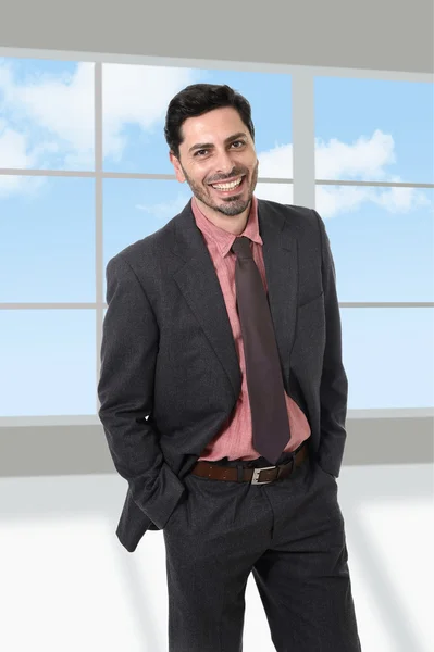 Corporate portrait of young attractive businessman at modern office — Stock Photo, Image