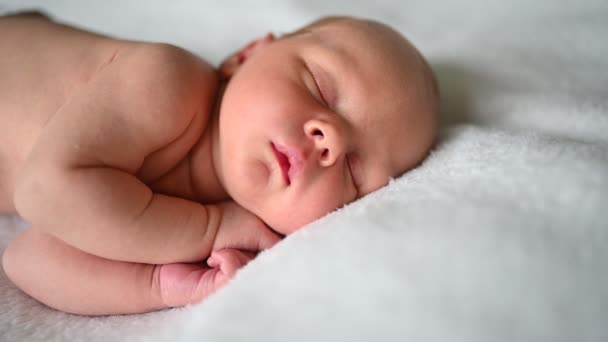Cute emotional newborn yawning funny little baby boy sleeping in crib. Infant baby. Nursery — Stock Video