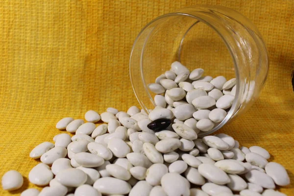 White Dry Beans Jar Lies Spilled Out Yellow Lemon Background — Stock Photo, Image