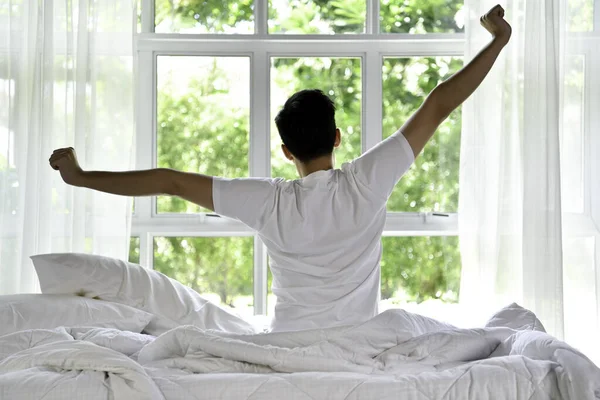 Asian Man Waking Morning Sitting Bed Stretching — Stock Photo, Image