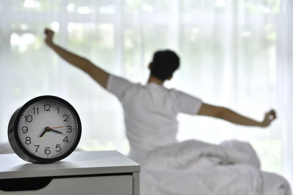 Man Waking Morning Sitting Bed Stretching Focus Alarm Clock — Stock Photo, Image