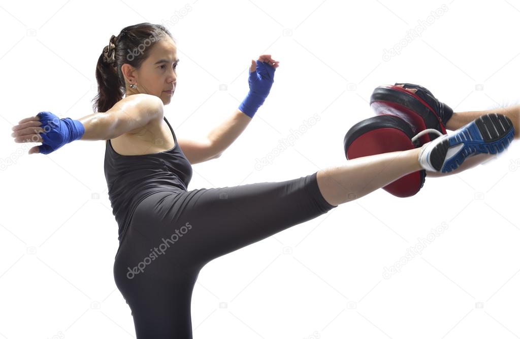 Woman practicing Thai boxing