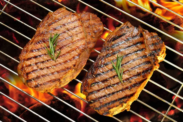 Grilled beef steak on the flaming grilled — Stock Photo, Image