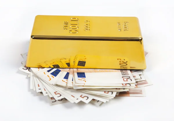 Ouro e muito dinheiro — Fotografia de Stock