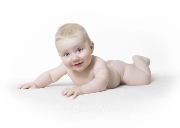 Naked baby laughs into the camera — Stock Photo, Image