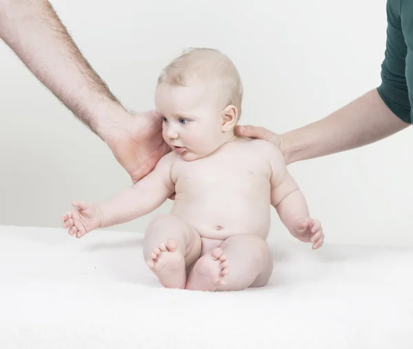 Baby is supported by arms — Stock Photo, Image