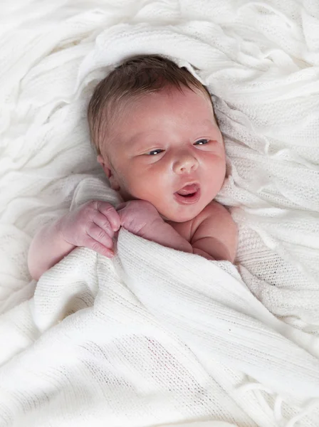 Infant with white blanket — Stock Photo, Image