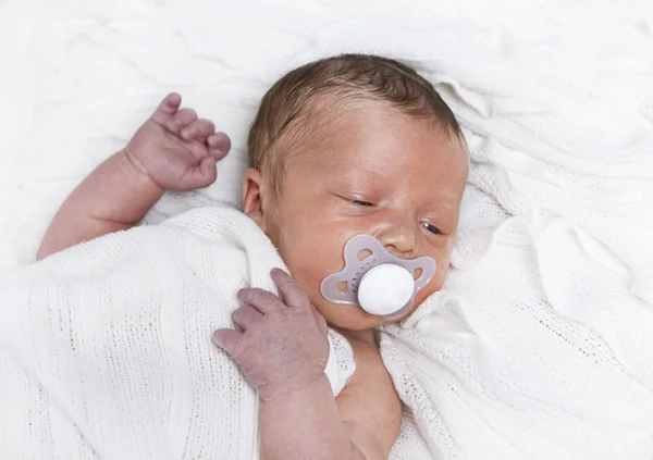 Infant with pacifier — Stock Photo, Image