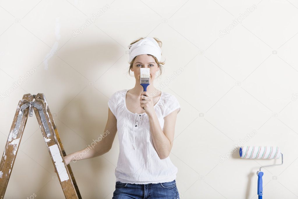 Woman with brush in front of face