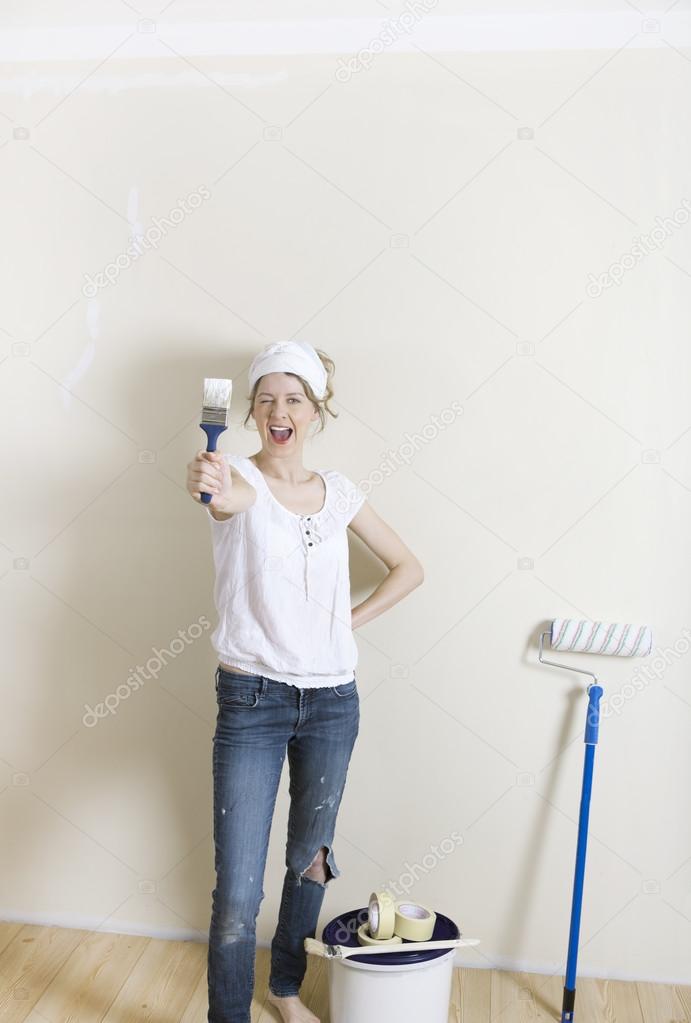 Woman looking forward to new wall color