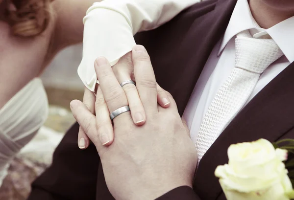 Hands with silver wedding rings — Stock Photo, Image