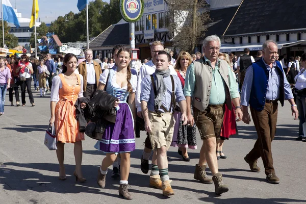 Oktoberfest visitors in costumes Jogdíjmentes Stock Fotók