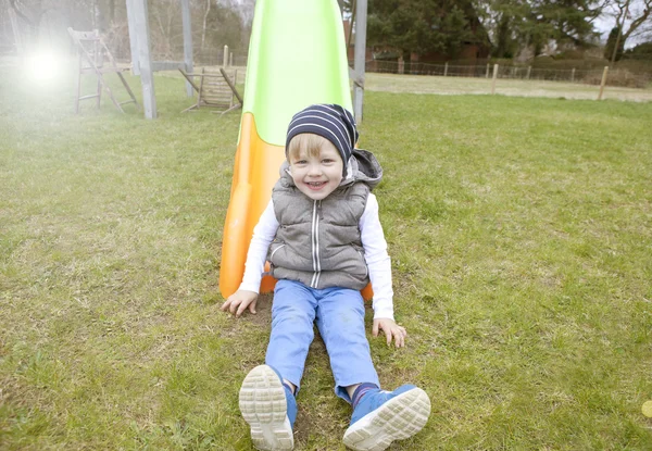 Boy on slide — Stock Photo, Image