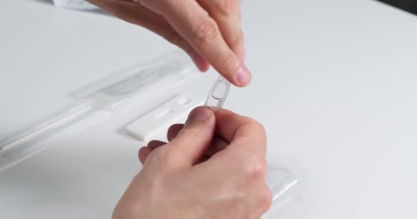 Process Taking Rapid Antigen Self Test Nasal Swab Pouring Liquid — Stock Video