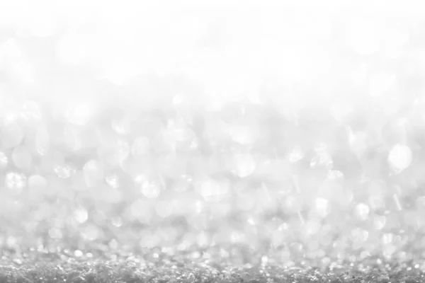 white, silver glitter vintage lights background defocused for festivals and celebrations