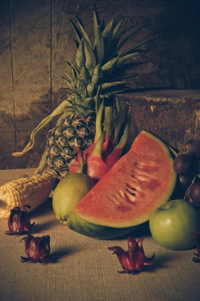 Still life with on the timber full of fruit.