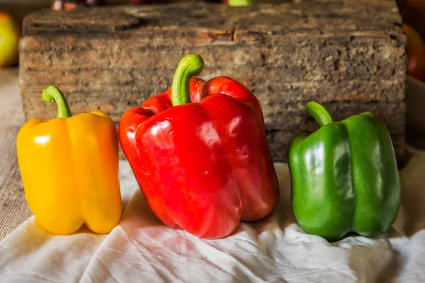 Still life with peppers, herbs, vegetables and fruits as an ingr — Stock Photo, Image