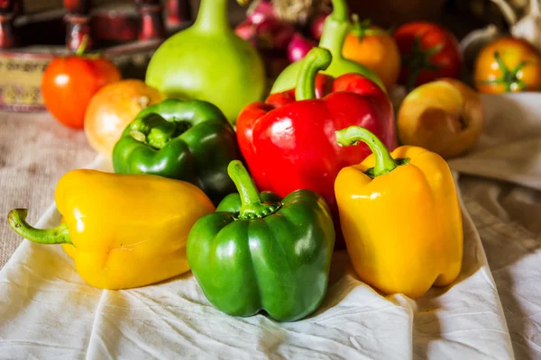 Still life with peppers, herbs, vegetables and fruits as an ingr — Stock Photo, Image