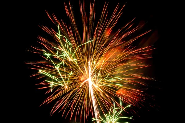 Brightly colorful fireworks a variety of colors in the sky at ni — Stock Photo, Image