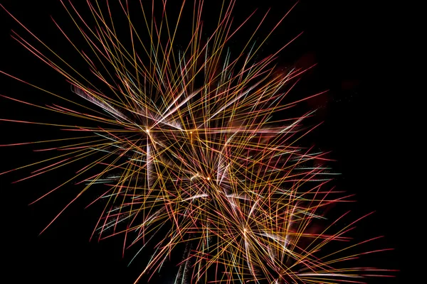 Brightly colorful fireworks a variety of colors in the sky at ni — Stock Photo, Image