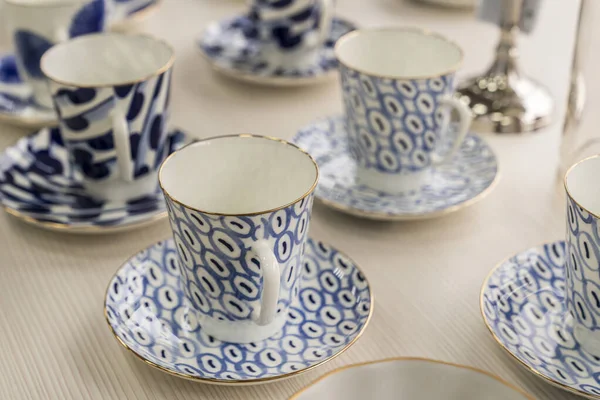 set of blue tea mugs with blue pattern