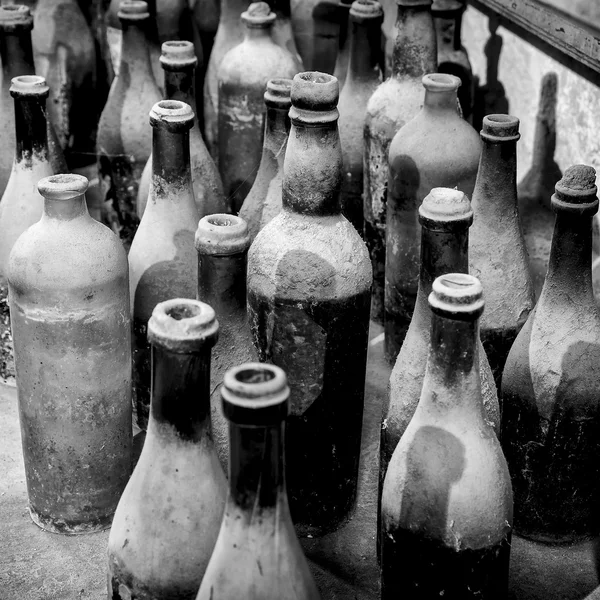 Very old bottles in black and white — Stock Photo, Image